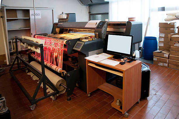 Digital textile printing Digital textile printing ink-jet (made in Italy). Textile printing is the process of applying colour to fabric in definite patterns or designs. In properly printed fabrics the colour is bonded with the fiber, so as to resist washing and friction. digital printing house stock pictures, royalty-free photos & images