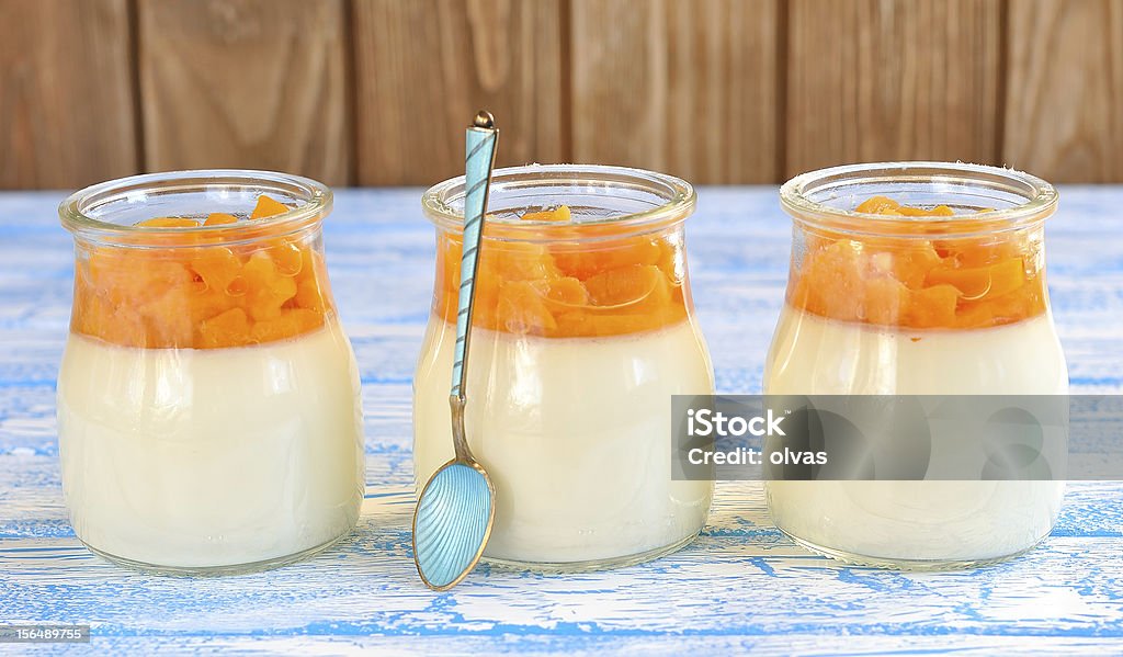 Panna cotta with fruit Panna cotta with fruit on a blue table Panna Cotta Stock Photo