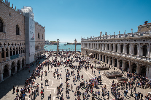 Venice, Italy - April 27, 2019 : Panoramic view of the famous square of Saint Mark and the Doge’s Palace  in Venice Italy on a sunny day