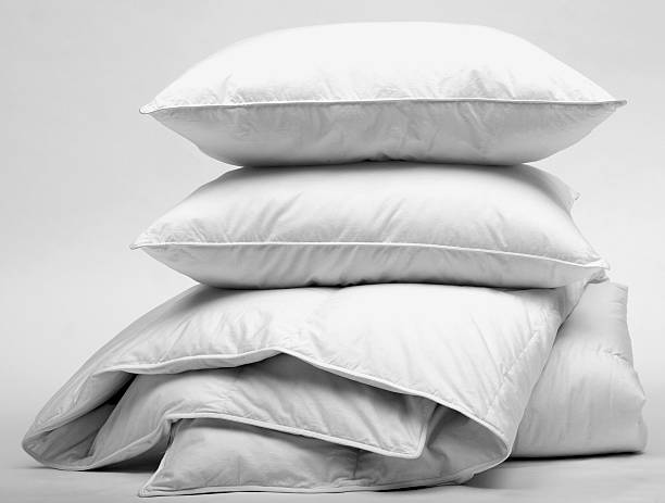 duvet and pillow White goose down duvet and pillows duvet stock pictures, royalty-free photos & images