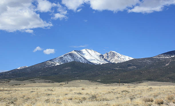 Mt. Wheeler from afar Mt. Whitney from the highway north of Great Basin National Park. The highest peak in Nevada, picture taken in April. great basin national park stock pictures, royalty-free photos & images