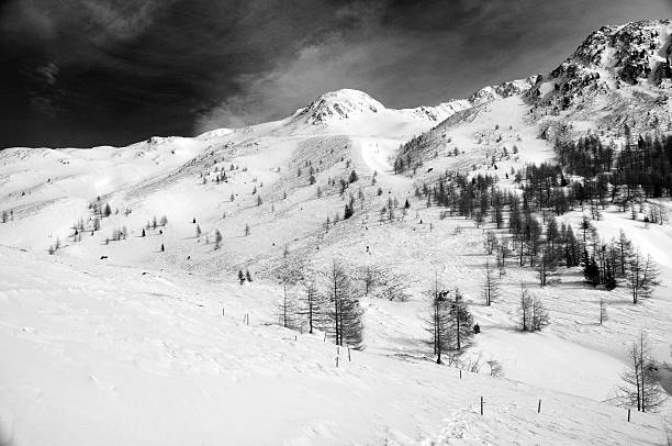 istock Snowy mountain landscape b&w with red filter 156494836