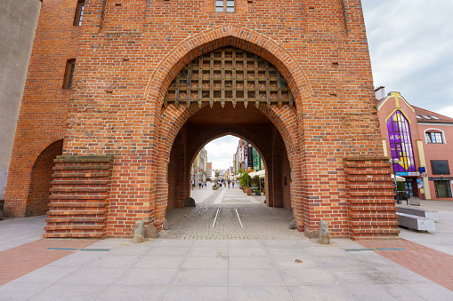 Olsztyn, Poland - 02 June 2023: The Upper Gate, known as the High Gate with wrought iron grating located in the northeastern part of the Old Town complex