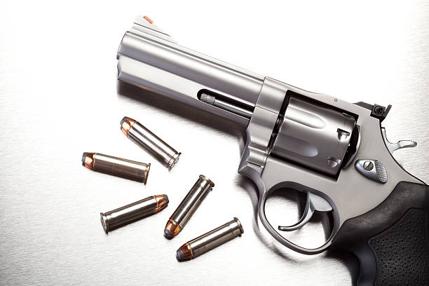 istock gun with bullets on steel 156498695