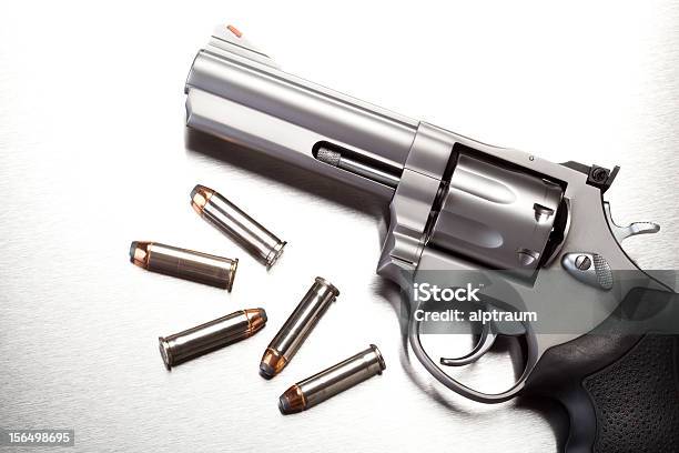 Gun With Bullets On Steel Stock Photo - Download Image Now - Ammunition, Animal Nose, Bullet