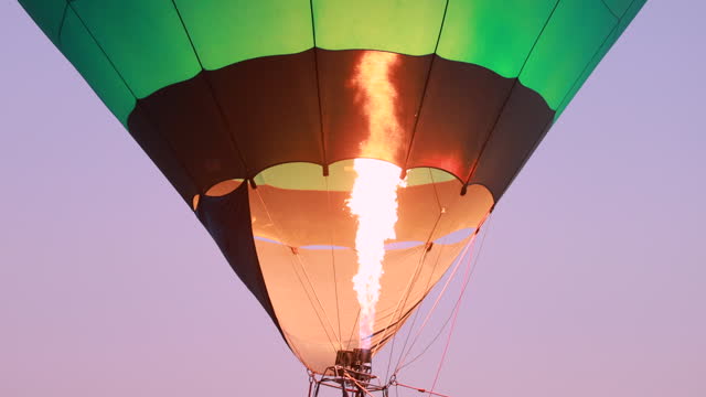 SLOW MOTION Flame adding heat to hot air balloon