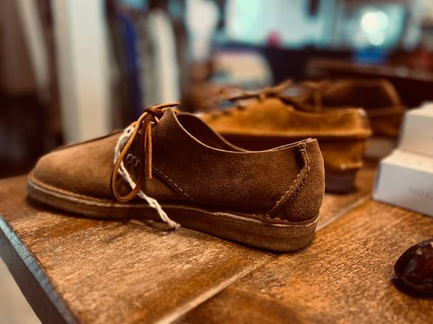 istock Brown suede shoes and shoelaces 1565004814