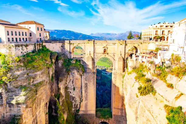 Scenic view of Ronda town skyline and Puente Nuevo bridge, Andalusia province, Spain travel photo