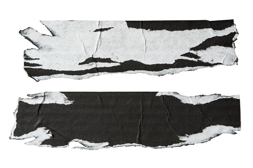 two pieces of peeled black and white paper on white background