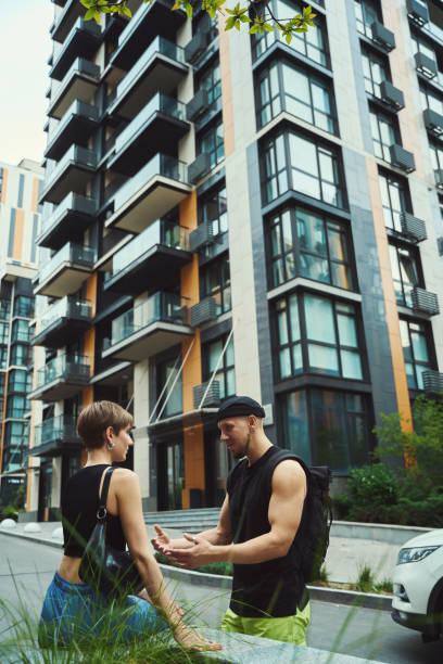 istock Caucasian couple having conversation in urban environment 1565042483