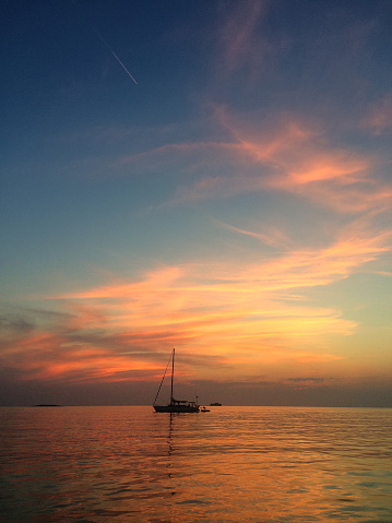 Anchored sailboat at sunset, Adriatic Sea, Croatia
