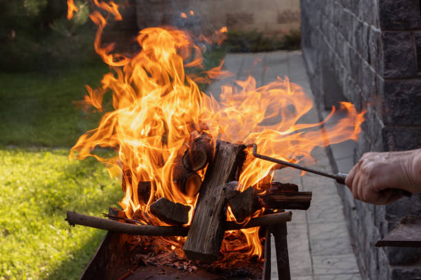 istock Firewood burns with a bright fire on an iron brazier before laying meat for a grill or barbecue 1565061810