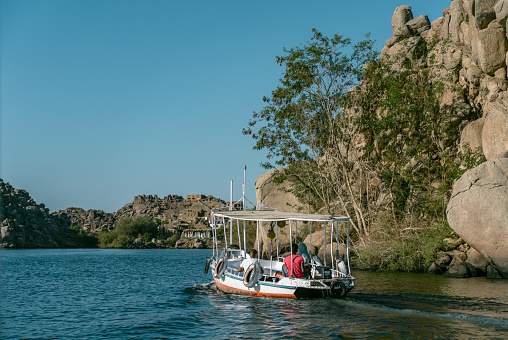 July 19th 2023, Aswan,Egypt:Tourists taking ferry to Philae Temple on Lake Nasser.The Philae temple complex is an island-based temple complex in the reservoir of the Aswan Low Dam, downstream of the Aswan Dam and Lake Nasser, Egypt.