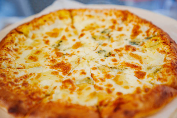 Appetizing cheese pizza. A traditional delicious dish of Italian cuisine.