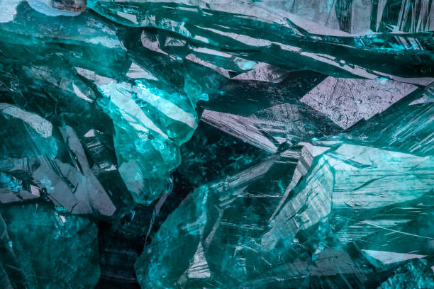 istock Dioptase crystal macro detail texture background 1565085144