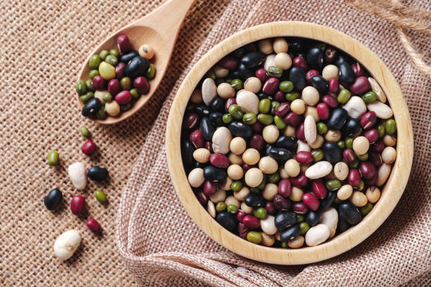 istock Five types beans in a wooden cup. 1565085233