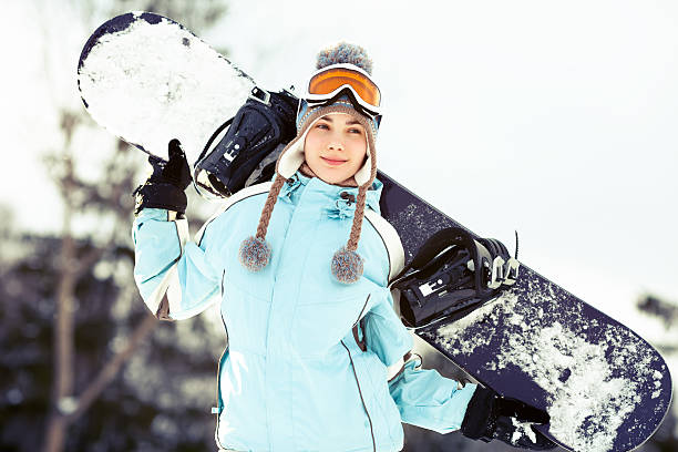 istock Young woman with snowboard 156508945