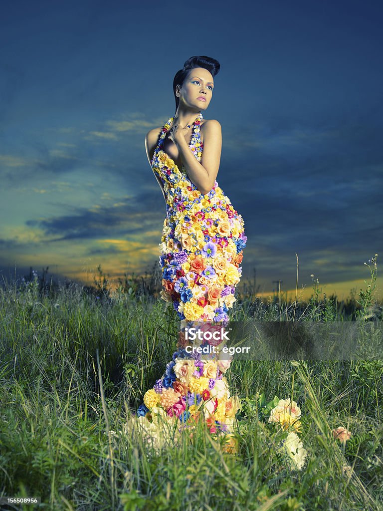 Beautiful lady in dress of flowers Fashion photo of beautiful lady in dress of flowers 20-24 Years Stock Photo