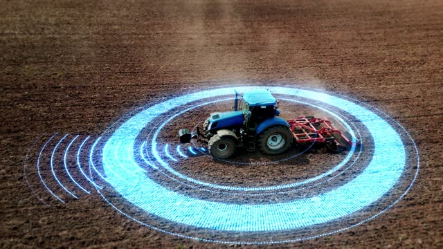 5G self-driving autonomous tractor without driver working the soil. Smart agriculture farming concept. Scanning the surrounding environment with sensors and radar, artificial intelligence technology.
