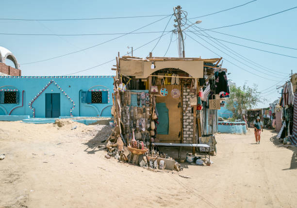 June 29th 2023,Aswan,Egypt:A tourist walking on street at Nubian village at desert in Aswan.Nubian village is one of the earliest human settlements in the world.