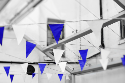 Festive pennants in an English town. Tilted plane of focus.