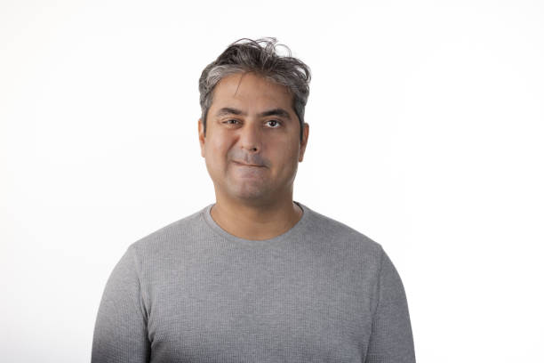 istock 40 year old Indian man with Tardive Dyskinesia looking at camera 1565130991