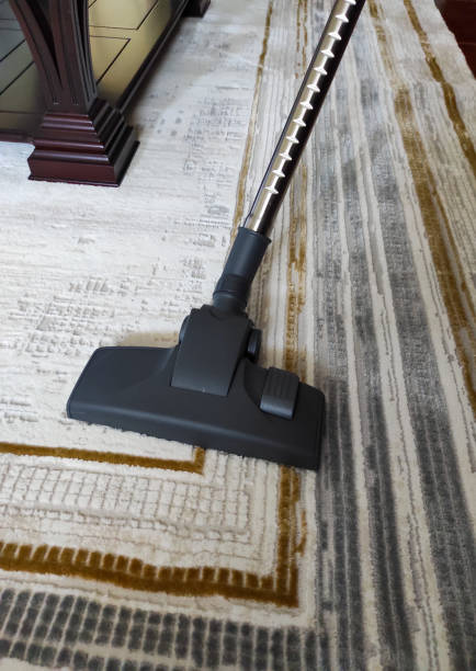 istock Vacuum cleaner vacuuming carpet in house cleanings 1565148135