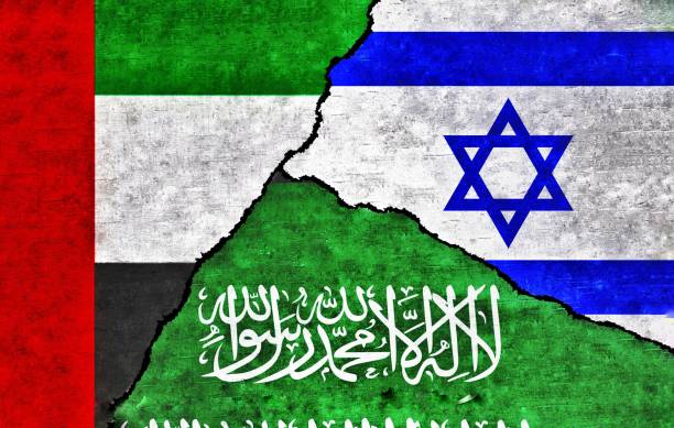 istock Saudi Arabia, UAE and Israel flags on wall with crack 1565166447