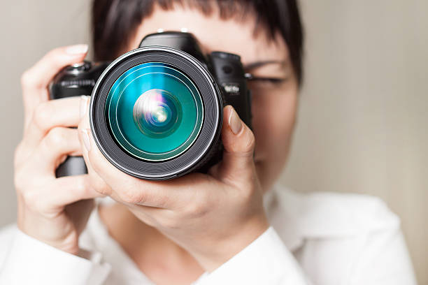 istock Woman photographer with camera 156517583