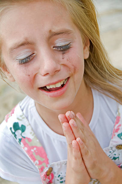 istock Little Girl Crying and Praying 156518134