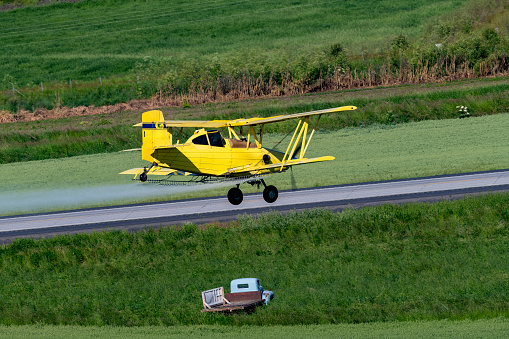 Farm crops sprayed with a crop duster