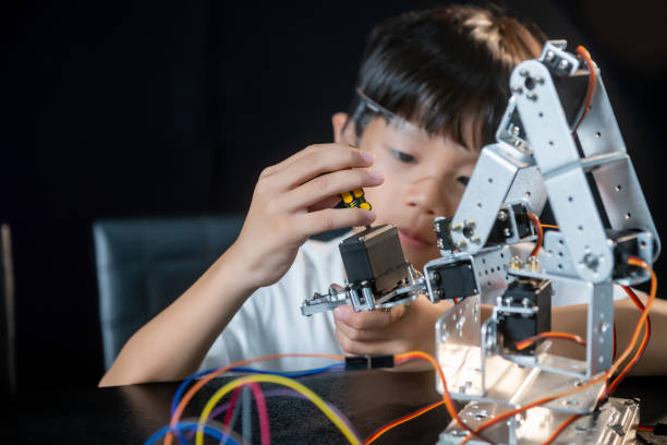 istock kids asian robotics project workshop education learning lesson robotics school science hobby activities childhood family 1565203496