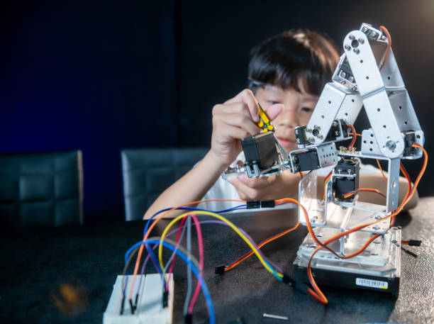 istock kids asian robotics project workshop education learning lesson robotics school science hobby activities childhood family 1565203497
