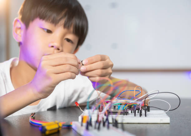 Group of happy kids build a robot project.