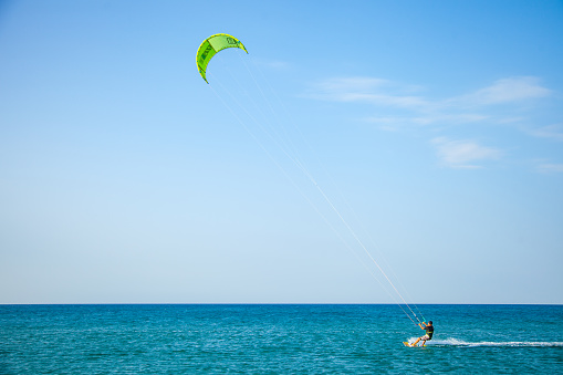 Canakkale, Turkey - 16 August 2017: Parachute surfing on Gokce Island. Gokce Island is a place preferred by parasurfers.