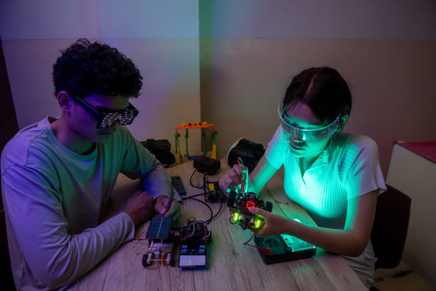 Group of happy kids build a robot project.