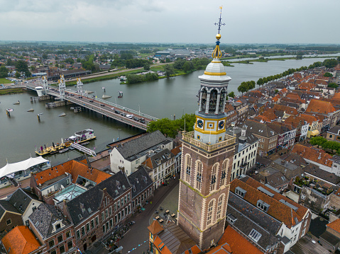 This aerial drone photo shows the Nieuwe Toren in Kampen, Overijssel. It is a large clock tower in the old city centre of Kampen.