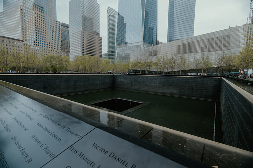 06 April 2019: The name of World Trade Center written on a marble near the 9/11 Memorial in Manhattan, New York City, USA.