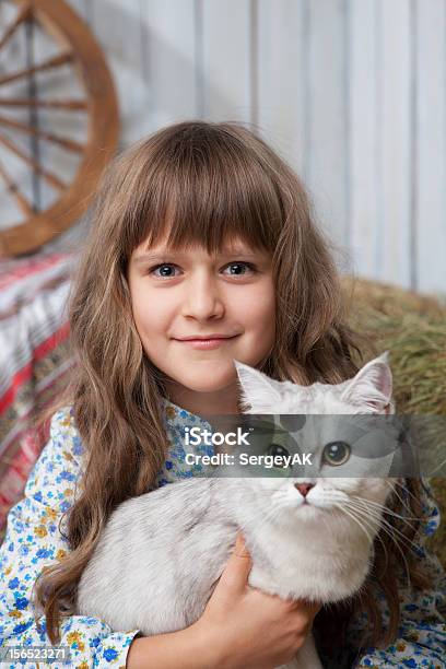 Portrait Sincere Girl Villager With Cat On Hands In Barn Stock Photo - Download Image Now