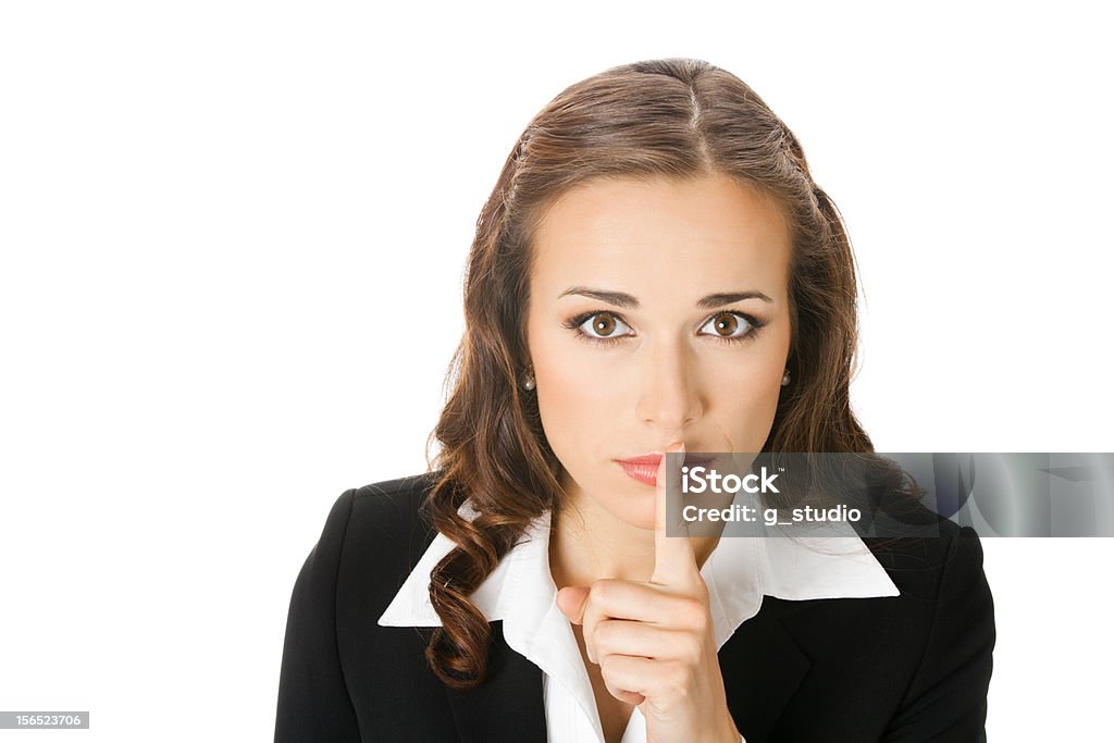 Poważny biznes kobieta Trzymając palec na jej usta - Zbiór zdjęć royalty-free (20-29 lat)