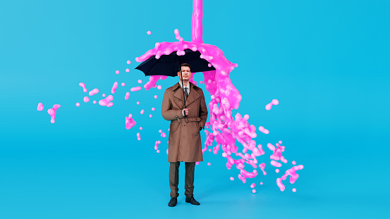 Surreal image of a man holding an umbrella, while a stream of pink paint drops from the sky. The paint hits the umbrella and falls to the side.