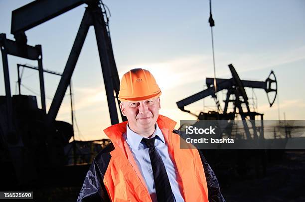 Engineer In An Oil Field Stock Photo - Download Image Now - Adult, Blue, Business