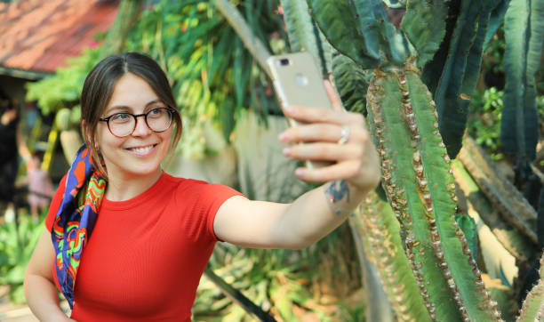 istock Young woman tourist make selfie 1565302722