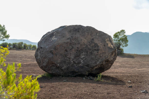 istock Volcanic bomb, rock isolated outdoors 1565324196