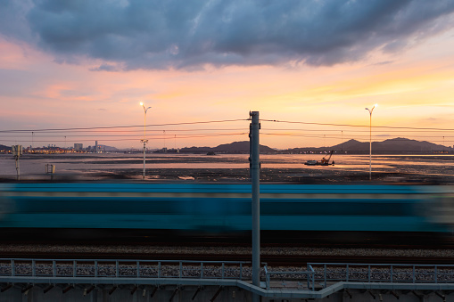 Railway track in the evening in sunset. Panoramic view on the railroad switch.