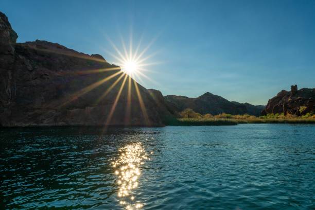 Free Stock Photo of The Sun Shines Brightly Over a River in a Canyon ...