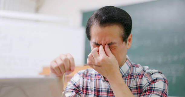 male professor has eyes pain