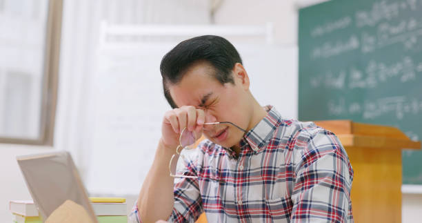 istock male professor has eyes pain 1565407095