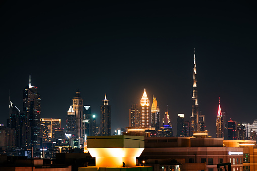 Dubai, United Arab Emirates - June 21, 2023: Illuminated Dubai skyscrapers at night