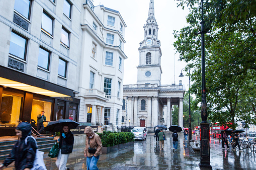 Wet streets in Downton London, during sunset in a gloomy rainy day on summer 2023. Wet streets in St Martin-in-the-fields. Photo taken by MAGALI GOMEZ